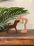 standing boy cuddling dog - Zambeel Art Studio